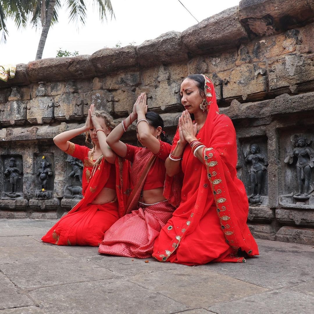Pilgrims offering prayers at an ancient Indian temple